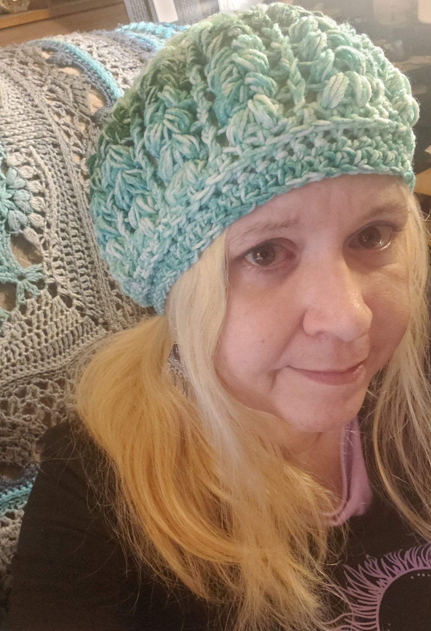 Women's crocheted green ombre beanie hat, fashion accessory, soft and elegant.