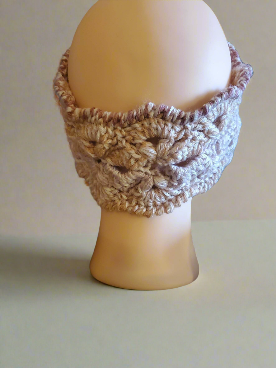 Pink crocheted earwarmer for women and teens, warm winter accessory with peach details.