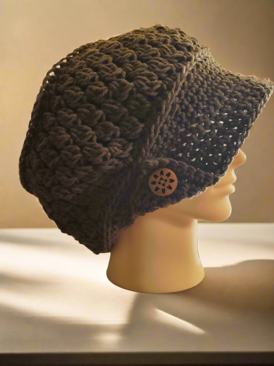 Handmade crocheted brown newsboy hat with decorative buttons, oversized size.