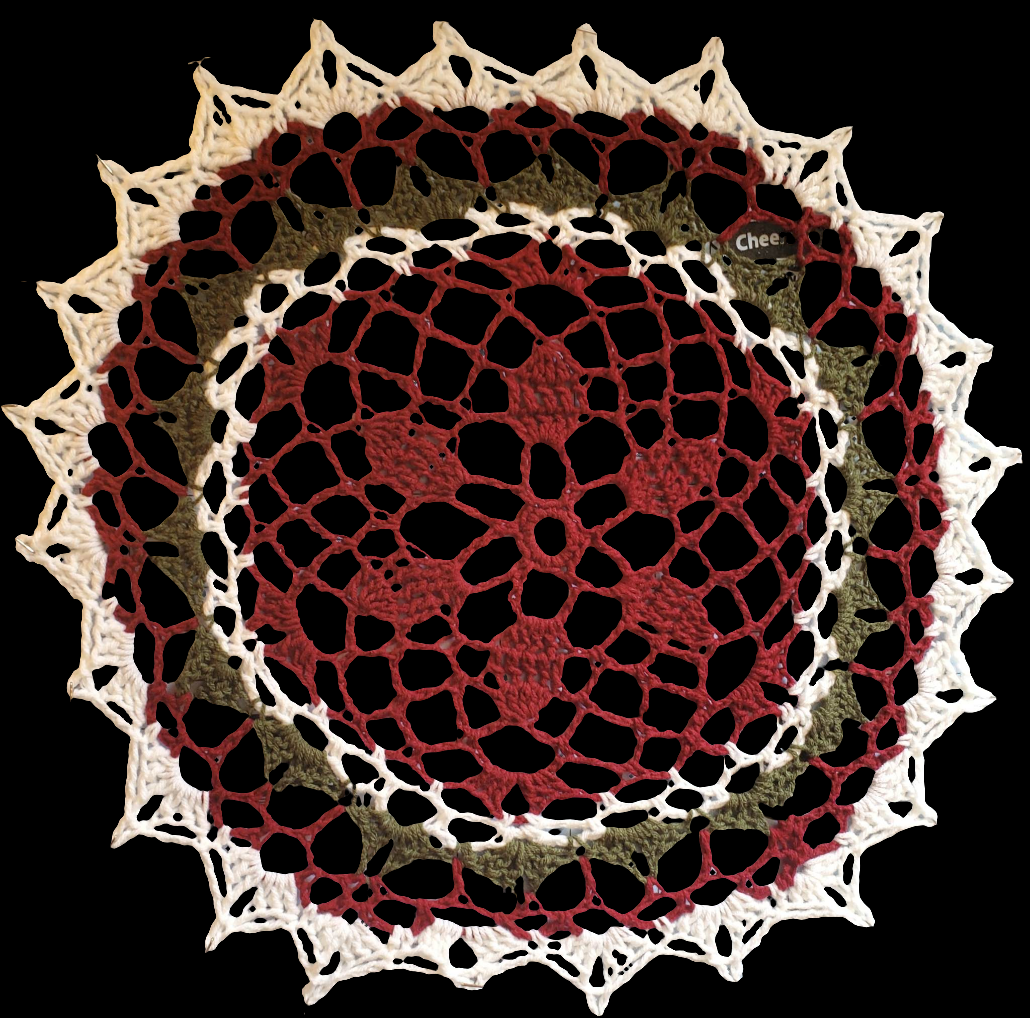 Red, green, and white Christmas doily for festive home decoration.