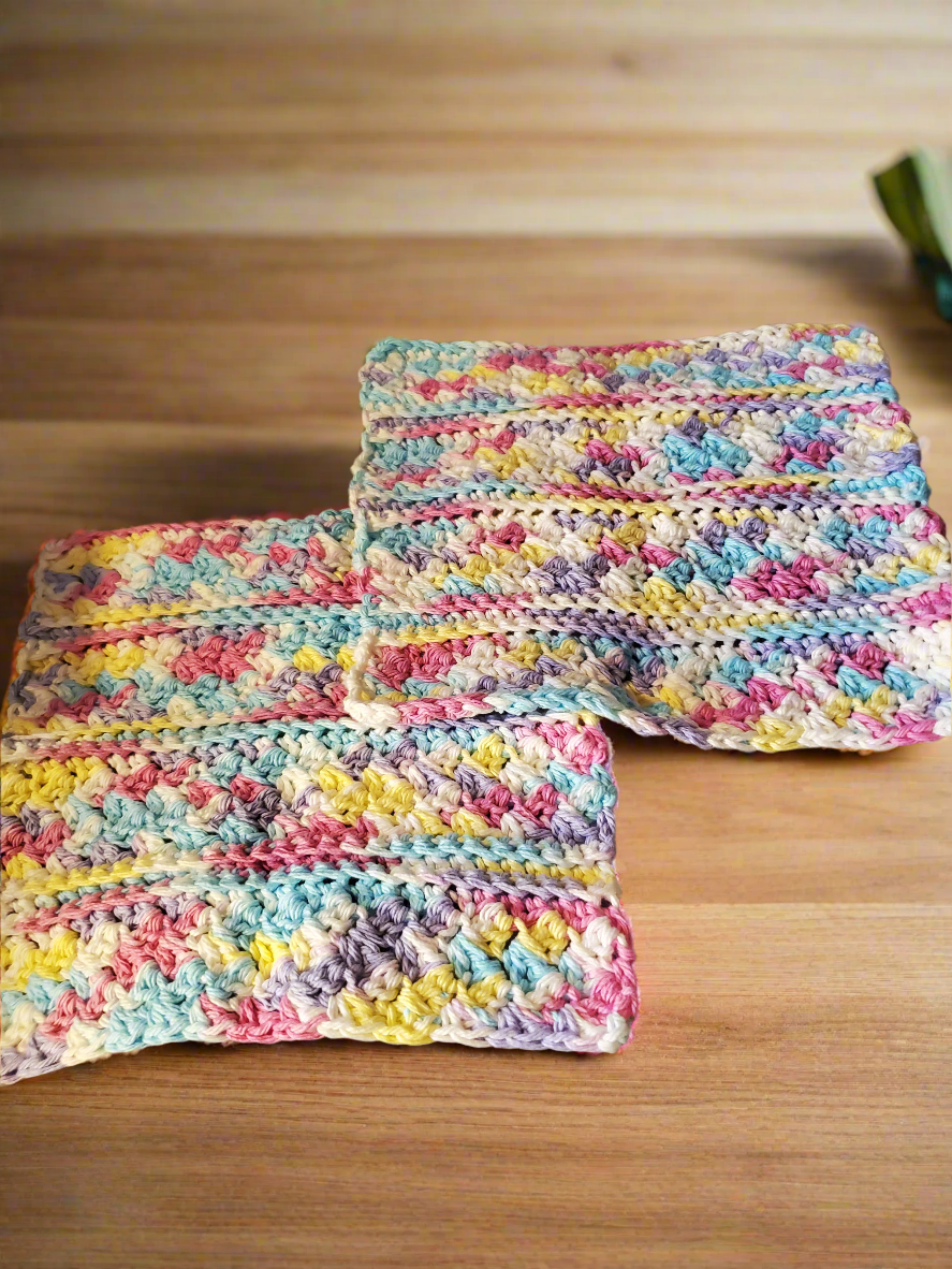 Crocheted cotton rainbow dishcloths set of 4, including 2 regular and 2 large textured for household cleaning.