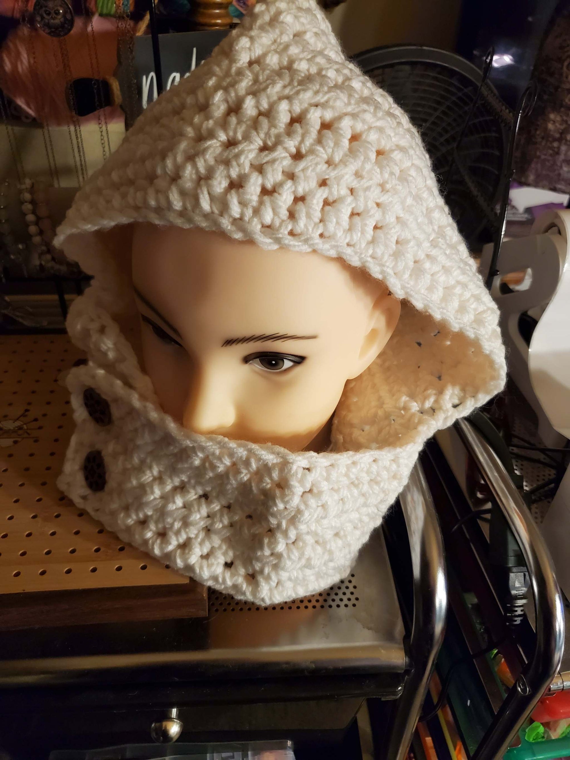 Women's white hooded cowl with buttoned front closure for fall and winter.