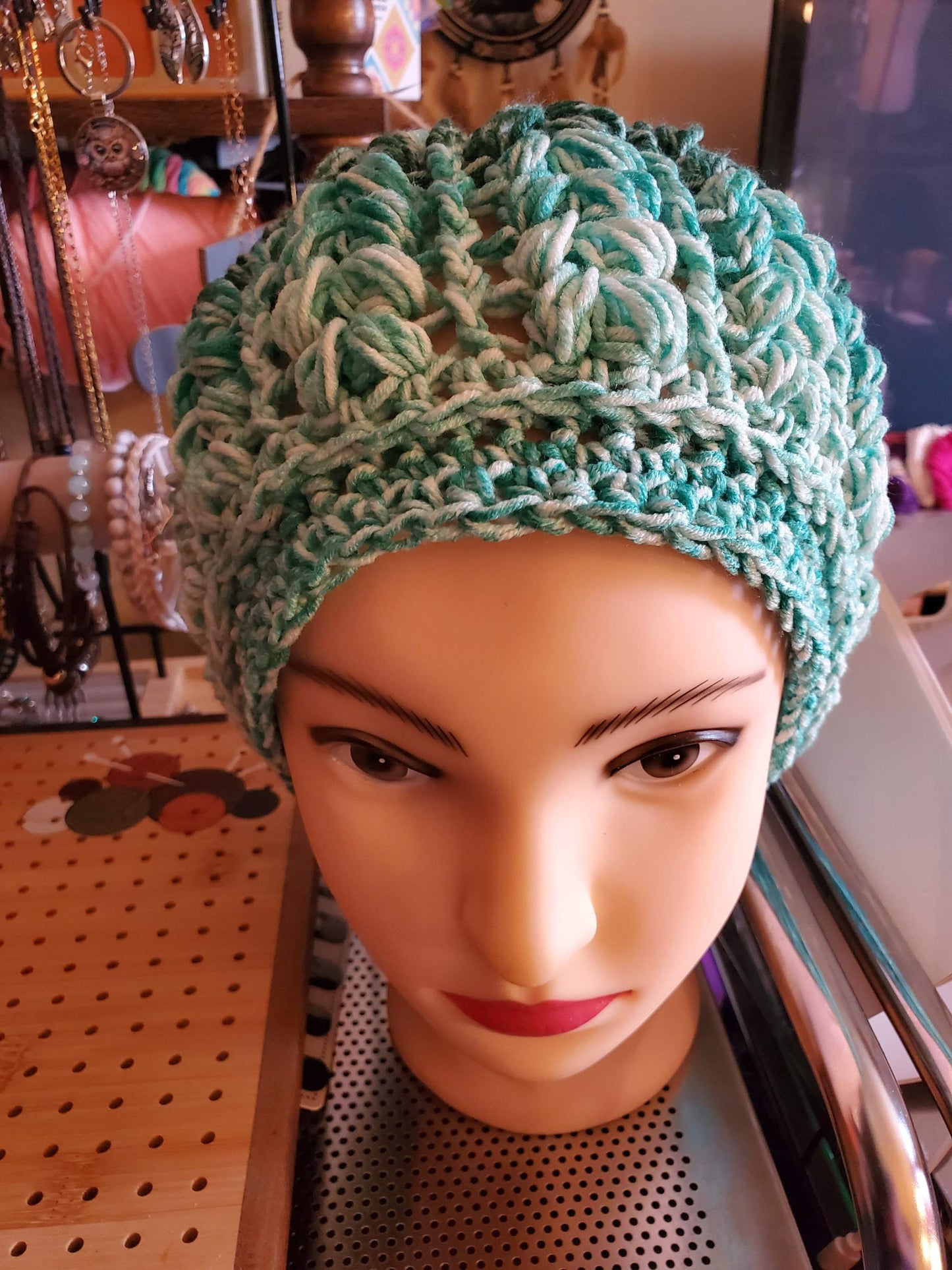 Women's crocheted green ombre beanie, soft fashion accessory for any occasion.