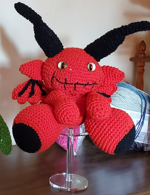 Lil Red Devil crocheted handmade toy with horns, perfect for toy collections and decor.