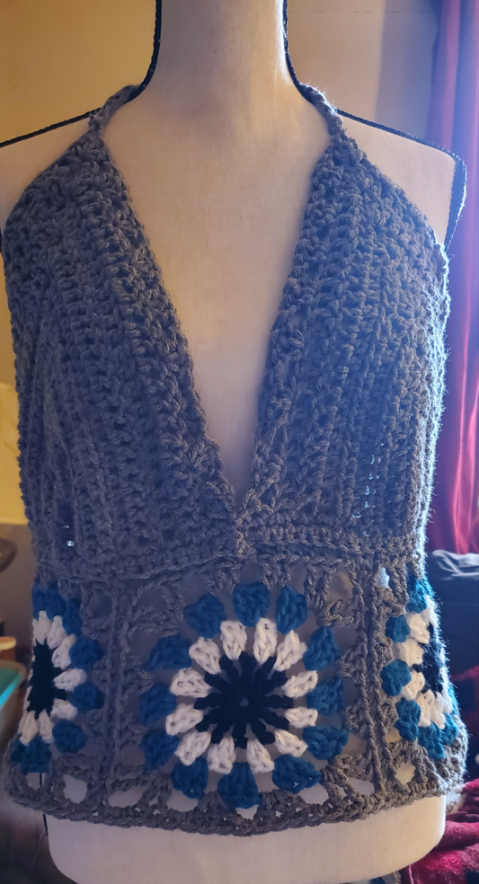 Handmade crocheted granny square tank top in boho style with marigold halter design.