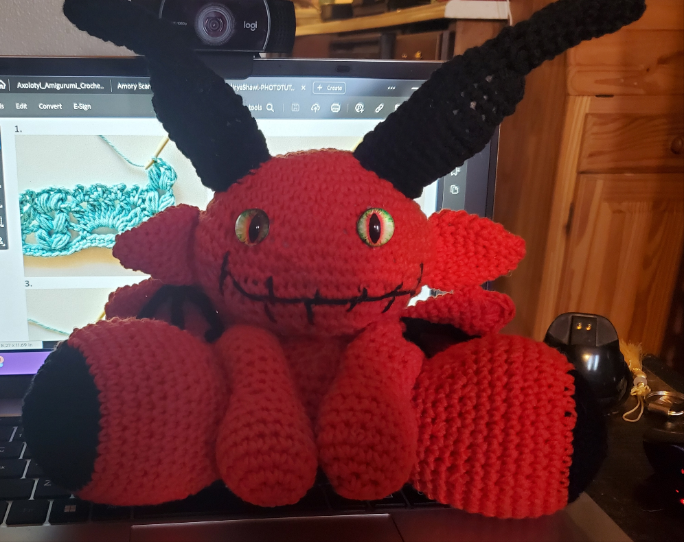 Lil Red Devil crocheted handmade toy with horns, perfect for toy collections and decor.