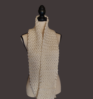 Thick white crocheted puff stitch infinity scarf on mannequin.