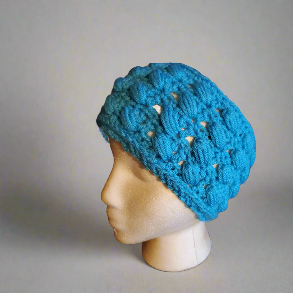 Handmade crocheted blue puff stitch ear warmer headband.