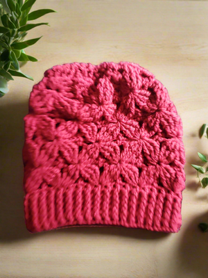 Beautifully crocheted flower of life hat in vibrant rose color.