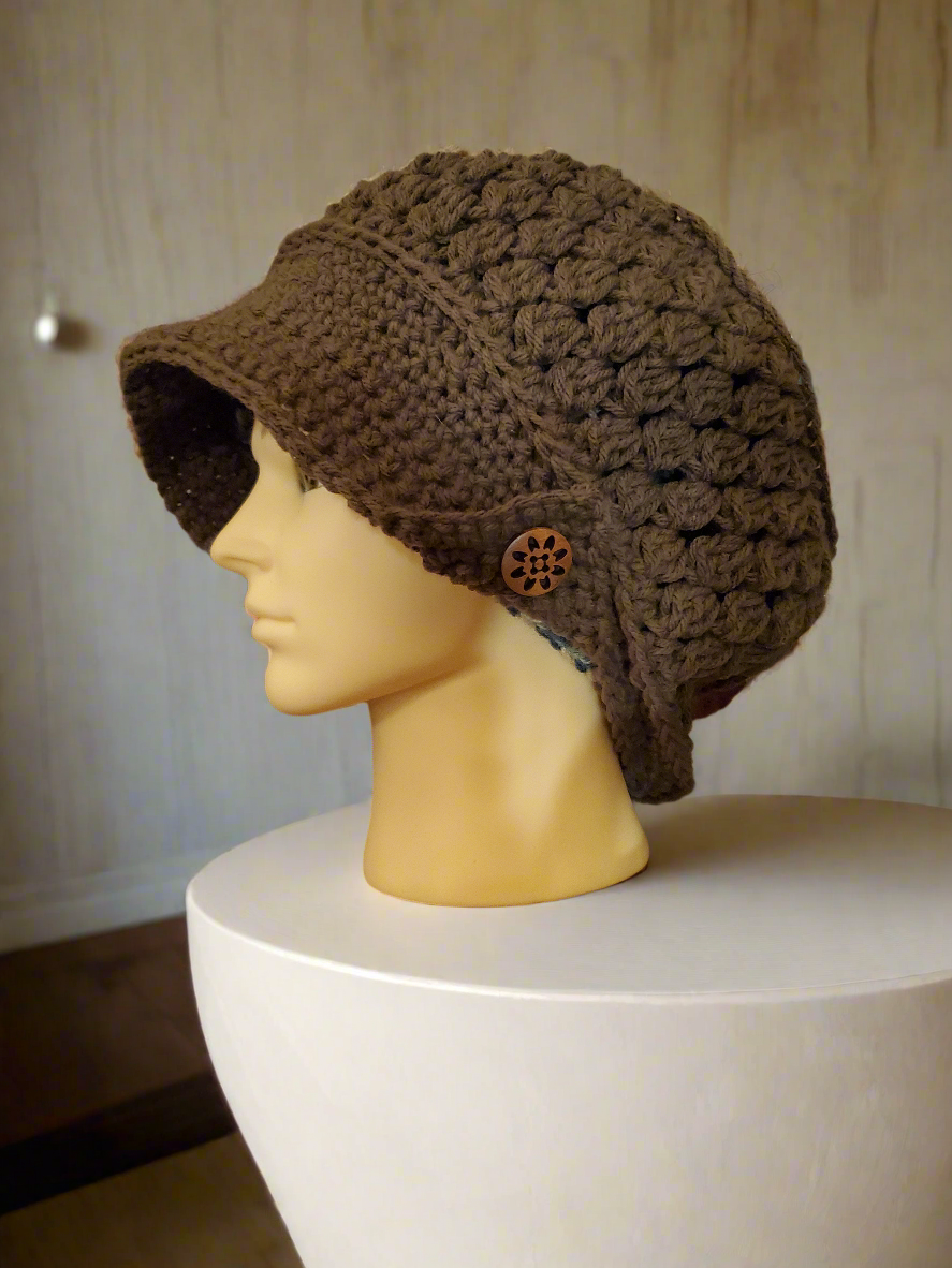 Handmade crocheted brown newsboy hat with vintage buttons and oversized fit.