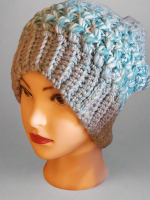 Soft chunky warm crocheted light blue slouch hat for men or women.