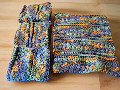 Set of 4 variegated dishcloths in dark blue, green, and brown for kitchen use.