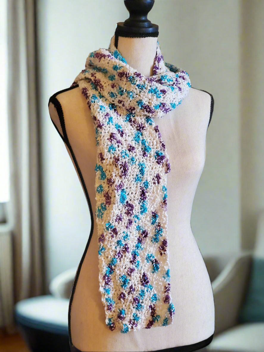 Beautiful multicolored cotton blend lightweight scarf with vintage yarn on display mannequin.