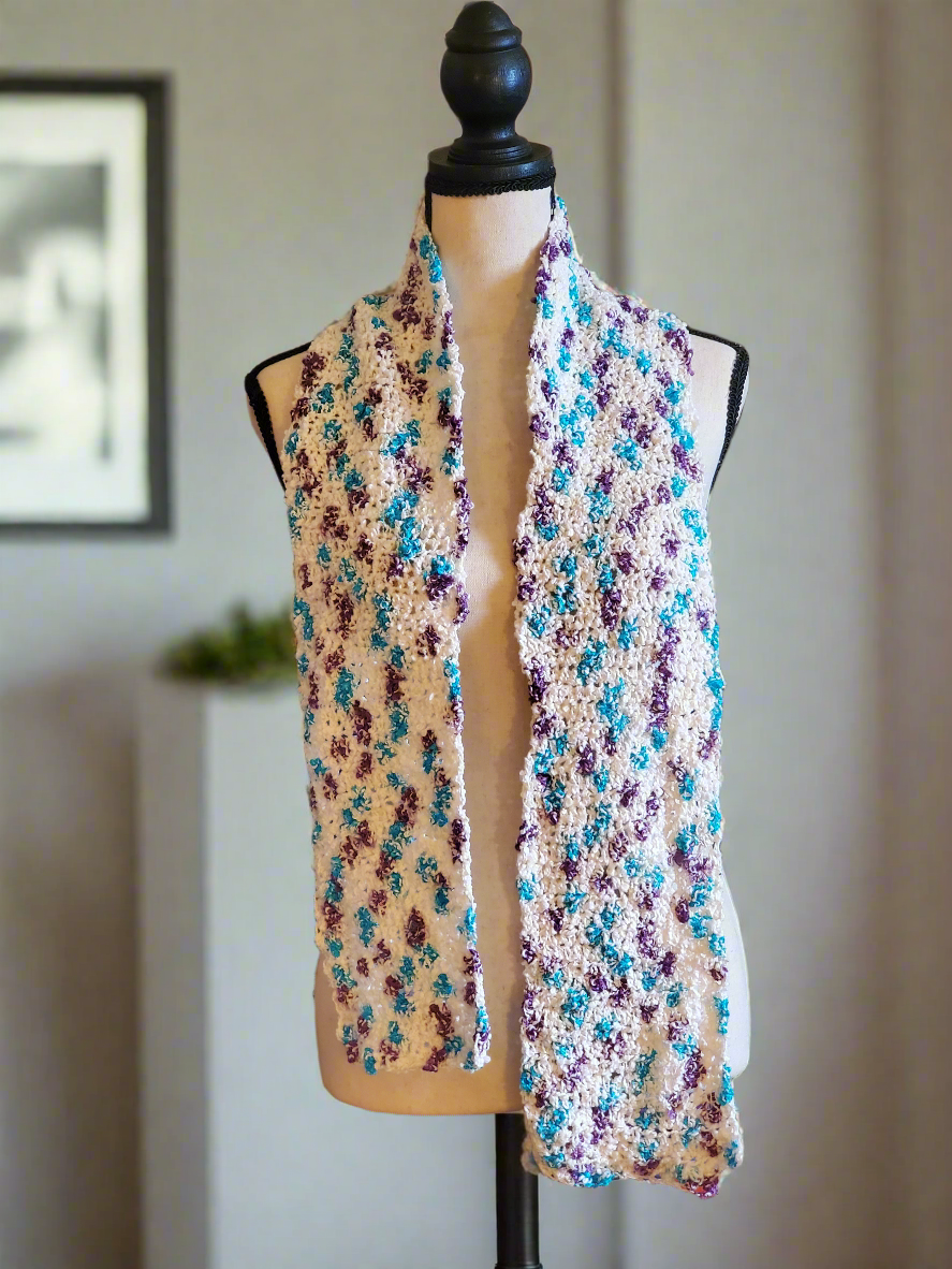 Beautiful multicolored cotton blend lightweight scarf with vintage yarn on display mannequin.