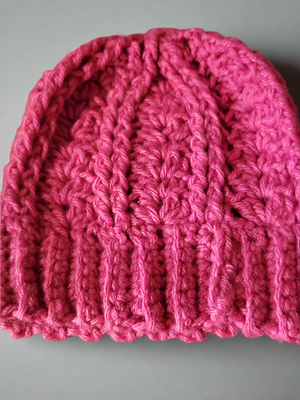 Adorable pink baby hat, cozy and soft for colder weather.