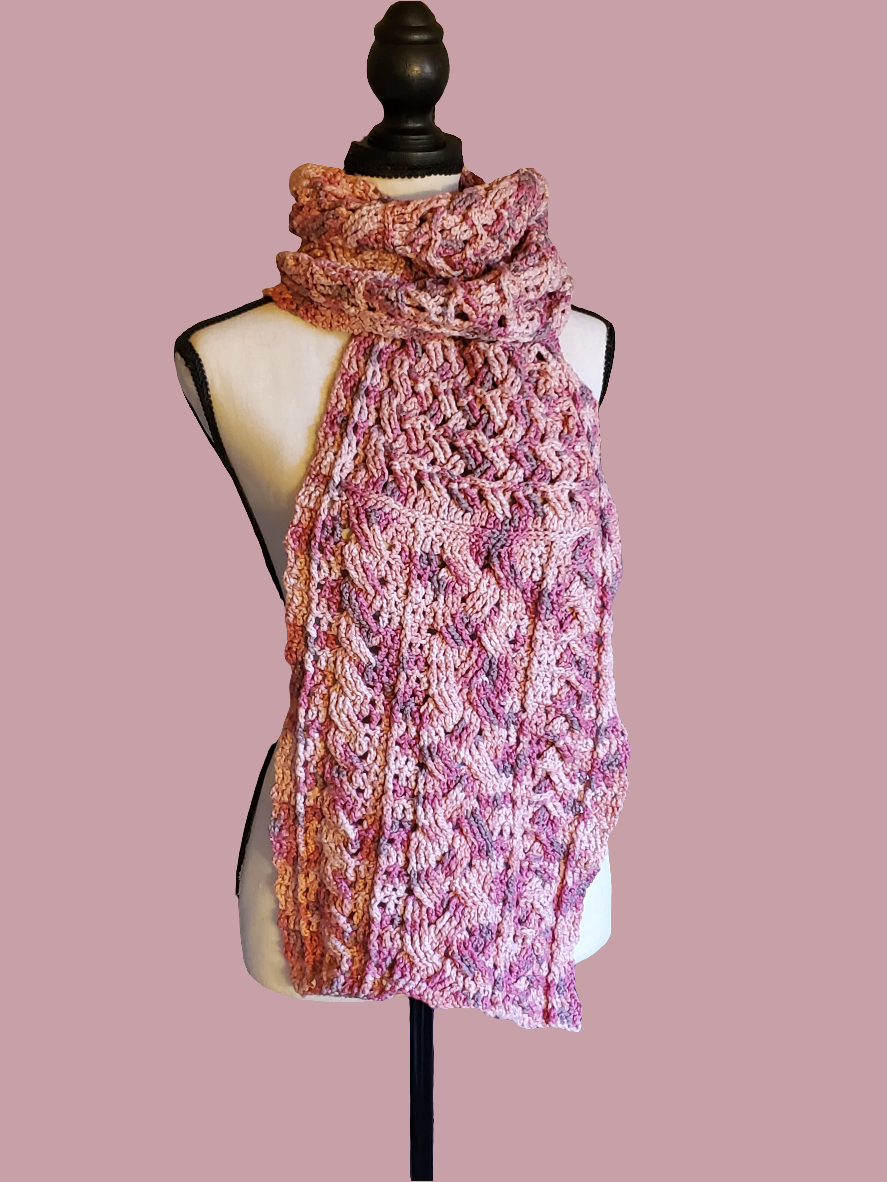 Handmade cotton blend cable scarf in various pinks with intricate crocheted design.