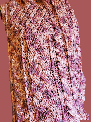 Handmade cotton blend cable scarf in various pinks with intricate crocheted design.