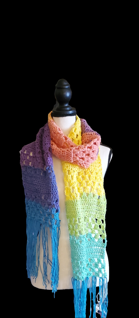 Rainbow Breeze Granny Stitch Scarf with vibrant rainbow gradient and playful fringe.