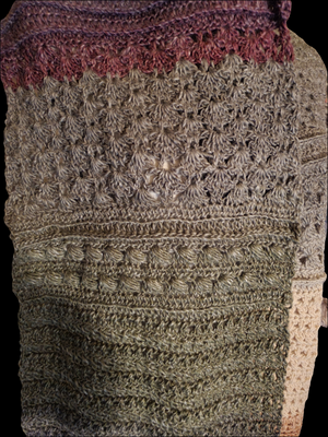 Handmade crocheted super scarf in earth tones with lightweight design.