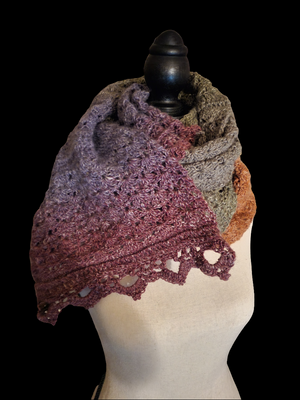 Handmade crocheted super scarf in earth tones, lightweight design.