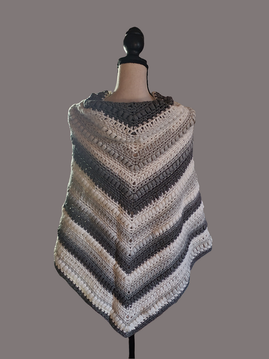 Elegant gray and white triangle wrap for ladies, textured design, versatile statement accessory.