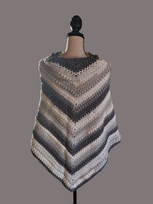 Elegant gray and white triangle wrap for ladies, textured design, versatile statement accessory.