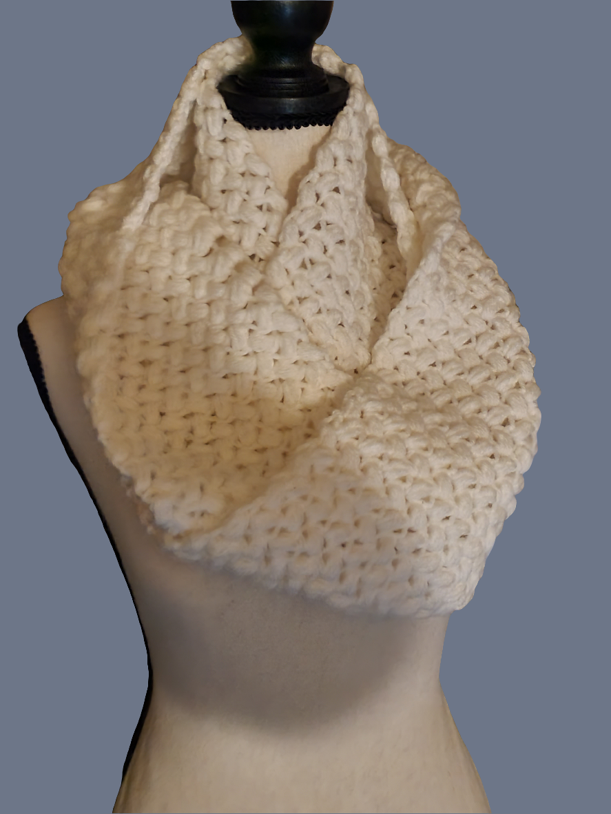 Thick white crocheted puff stitch infinity scarf on mannequin