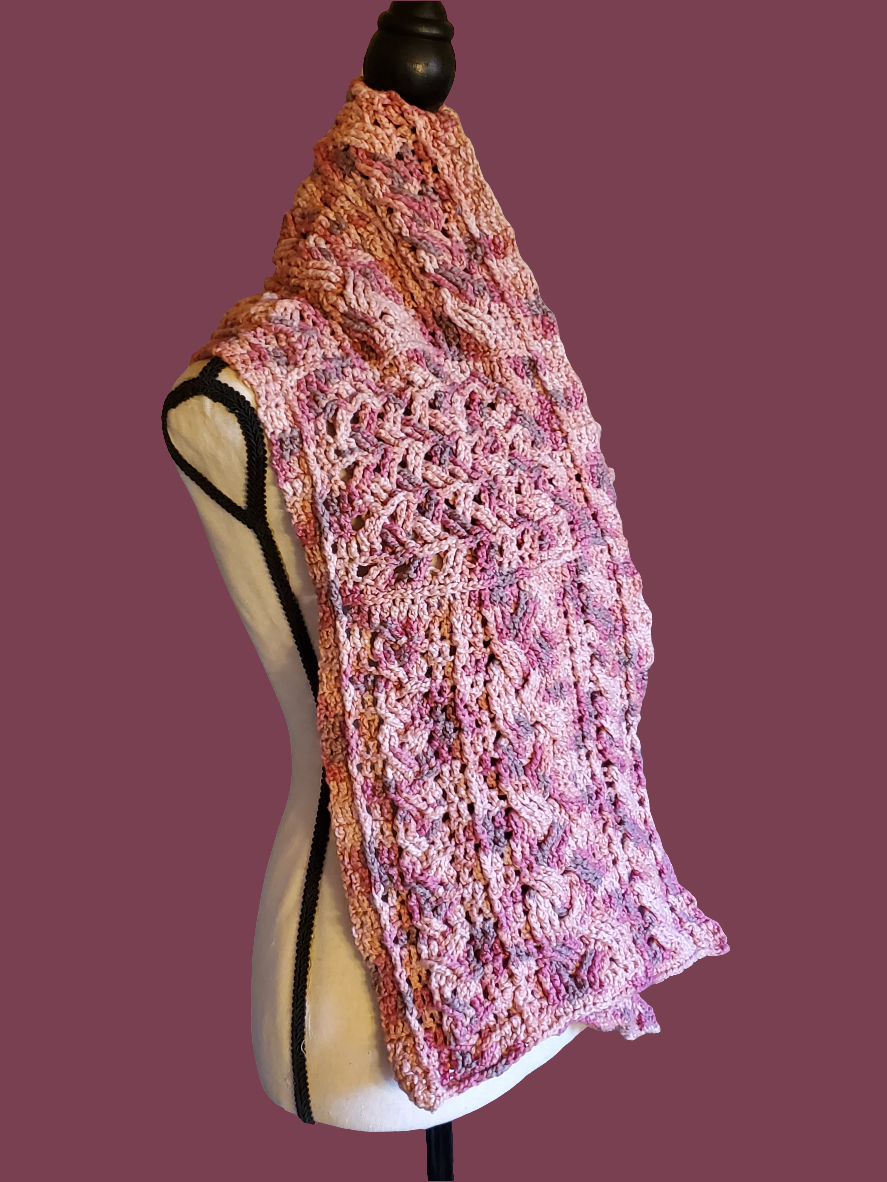 Handmade cotton blend cable scarf in various pinks with intricate crocheted design.