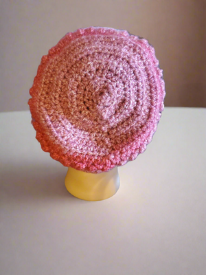 Beautifully crocheted soft pink hat for women and teens.