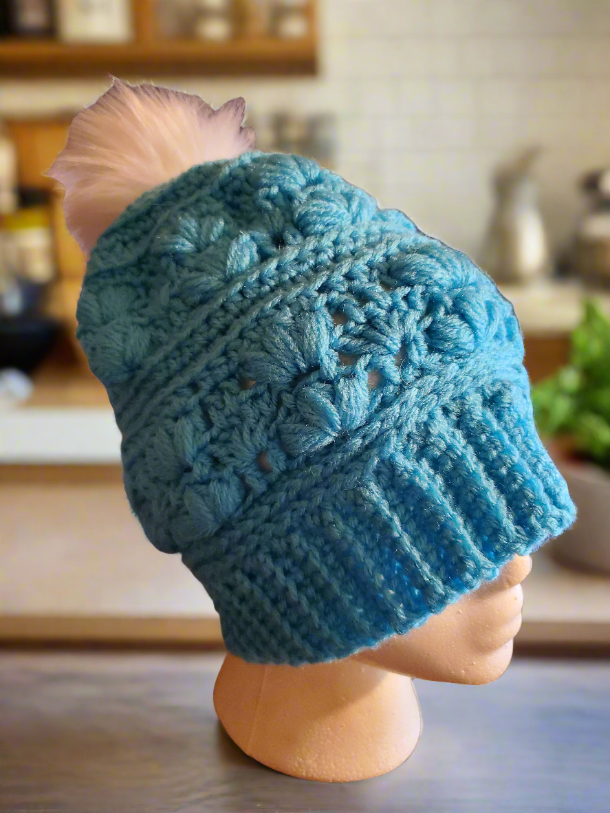 Handmade Teal Amarie Slouch Hat with fancy crochet details on mannequin.