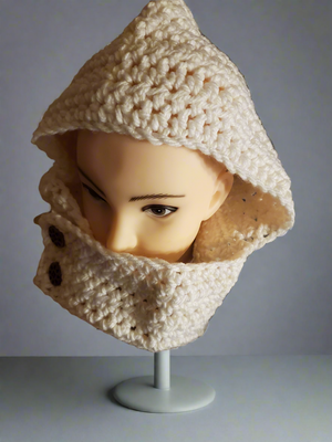 Women's white hooded cowl with buttoned front closure, ideal for fall or winter.