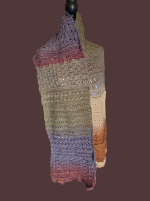 Handmade crocheted super scarf in earth tones, lightweight design.