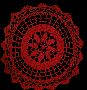 Red Christmas placemat doily in rich red, 20-inch diameter, festive home decor.