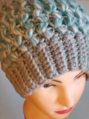 Soft chunky warm crocheted light blue slouch hat for men or women.