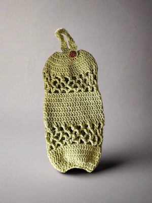 Handmade crocheted acrylic plastic bag holder with a hanging loop for organizing bags.