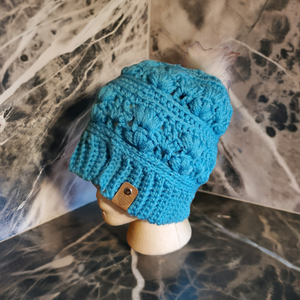 Handmade teal Amarie slouch hat, crocheted with fancy details.