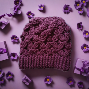 Beautifully crocheted flower of life hat in purple with intricate design.