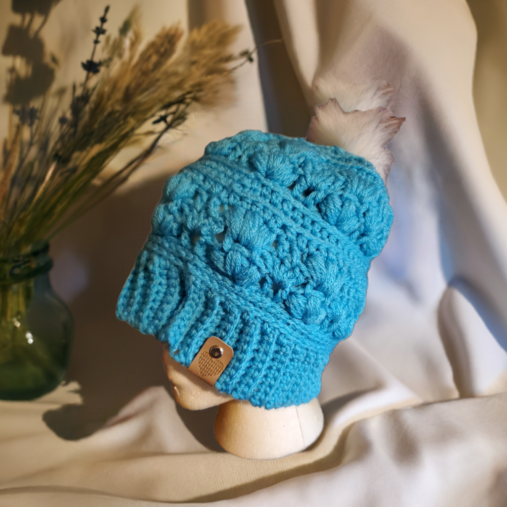 Handmade Teal Amarie Slouch Hat with fancy crochet details on mannequin.