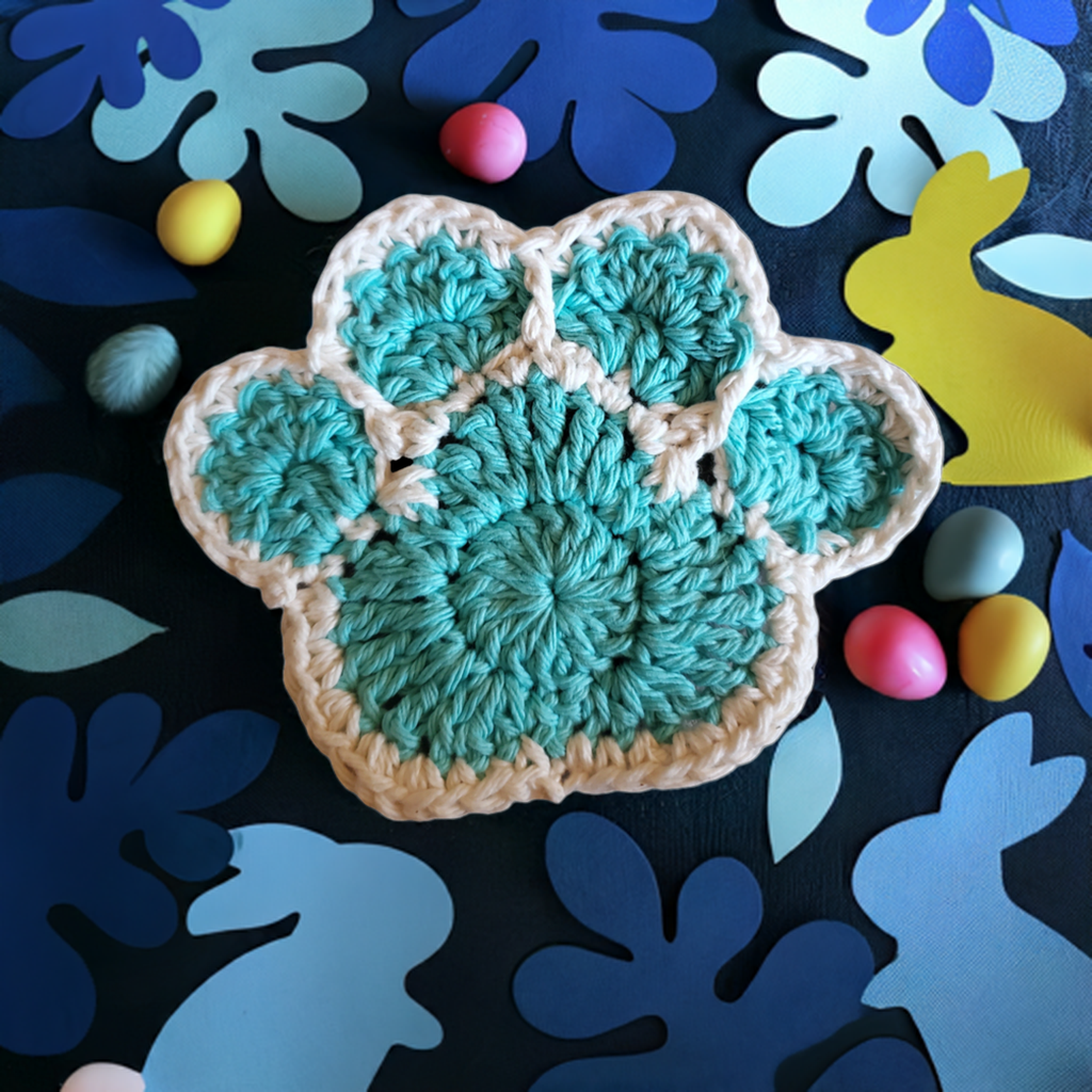 Handmade cotton paw print coaster set, crocheted tableware for home decor.