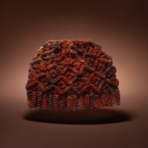 Handmade variegated dark brown crocheted winter beanie hat on display.